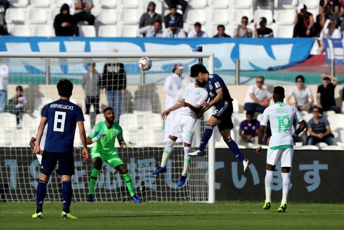 Takehiro Tomiyasu (2nd-R) headed home from a corner to send Japan through to the last eight