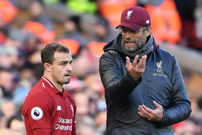 Jurgen Klopp talks to midfielder Xherdan Shaqiri during Liverpool's 4-1 win over Cardiff at Anfield