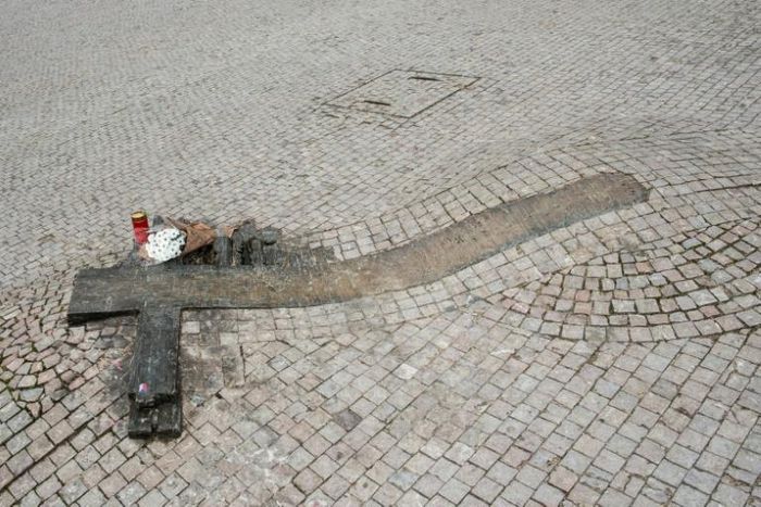 Flowers lie at spot in Prague where student Jan Palach set himself alight 50 years ago