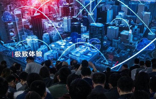 Journalists watch a trailer at the launch of new 5G Huawei products in Beijing in January
