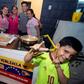 The 11 members of the Villamarin family left Venezuela a month ago and now get by selling Venezuelan street food in Lima, the capital of Peru