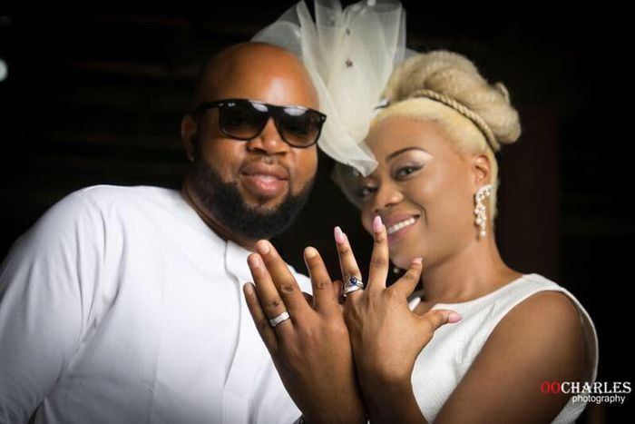 The gorgeous couple flash their wedding rings