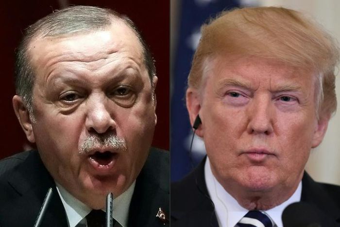 US President Donald Trump, right, is warning his Turkish counterpart Recep Tayyip Erdogan of economic devastation should Ankara hit Kurdish forces after the American troop pullout from Syria
