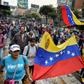 Venezuelan opposition supporters take part in a march on the anniversary of 1958 uprising that overthrew military dictatorship in Caracas on January 23, 2019