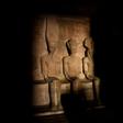A picture taken on October 22, 2016, shows a ray of light illuminating the statue of Ramses II inside the temple of Abu Simbel in Egypt