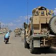 Vehicles of the US-led coalition battling the Islamic State group patrol the town of Rmelane in Syria's Hasakeh province on June 5, 2018