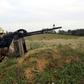 A member of the Tripoli Protection Force militia alliance takes a position south of the Libyan capital during clashes with the Seventh Brigade group