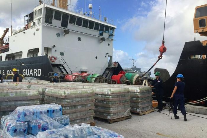 Various US supplies being loaded onto a ship in Guam before setting sail to Saipan in the Northern Mariana Islands to help those affected by Super Typhoon Yutu