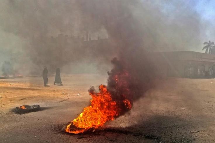 Sudanese protestors burn tyres during an anti-government demonstration on January 18, 2019 in the capital Khartoum