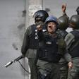 Soldiers from Venezuela's National Guard fired tear gas at protesters near the Cotiza command post taken over by rebel troops aiming to overthrow President Nicolas Maduro