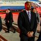 US Secretary of State Mike Pompeo (C) and his wife Susan (C, behind) walk on the runway after disembarking from their plane Abu Dhabi International Airport on January 11, 2019