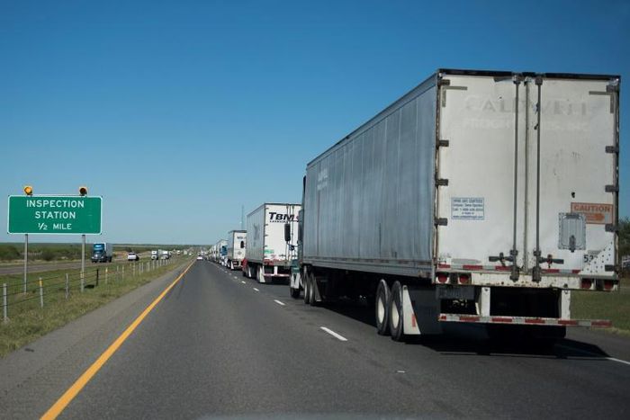Tractor-trailers awaiting inspection at the US-Mexico border in Laredo, Texas