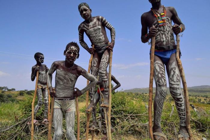 Traditionally mixed from clay, chalk, ash and cattle dung, the white or grey body paint is widely thought to help individuals moderate body heat amid soaring bush and savanna temperatures