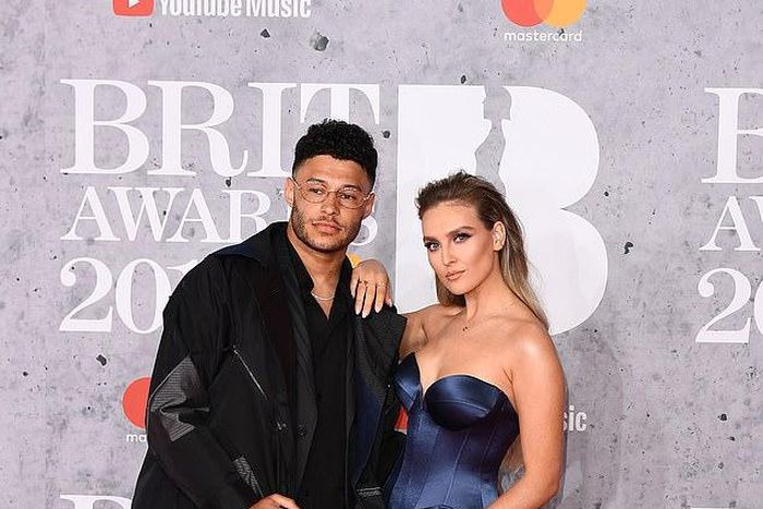 Alex Oxlade-Chamberlain attended the BRIT Awards with his girlfriend, Little Mix star Perrie Edwards [Getty Images]