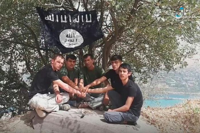 A image taken from a video released by The Islamic State's (IS) Amaq News Agency on July 31, 2018, allegedly shows the five executors of an attack on foreign tourists on a bike tour in southern Tajikistan