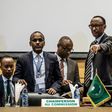 African Union chairperson and Rwanda's President Paul Kagame (R) gestures at the beginning of an African Union High Level Consultation Meeting with African leaders regarding the DR Congo election