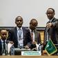 African Union chairperson and Rwanda's President Paul Kagame (R) gestures at the beginning of an African Union High Level Consultation Meeting with African leaders regarding the DR Congo election