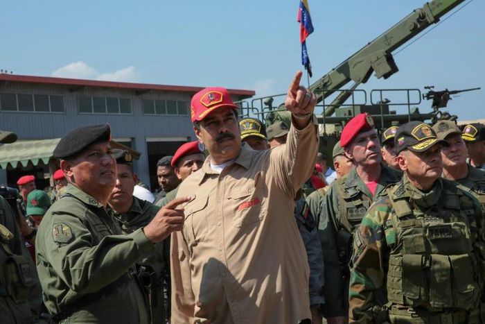 Handout picture released by the Venezuelan presidency showing President Nicolas Maduro (C) at a naval base in Puerto Cabello, Carabobo State, on January 27, 2019