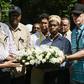 DusitD2 hotel General Manager Michael Metaxas (R), a survivor, placed a wreath with other staff at the gate of the complex in Nairobi where 21 people were killed