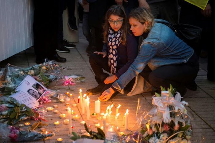 Moroccans lit candles and laid flowers in memory of murdered hikers Louisa Vesterager Jespersen and Maren Ueland after their killing in December