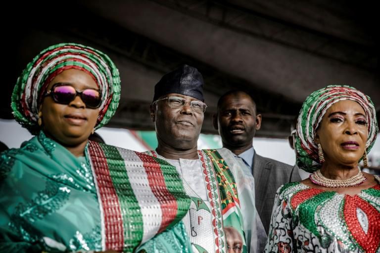 Nigerian opposition Peoples Democratic Party (PDP) presidential candidate Atiku Abubakar (second from left) bills himself as a dynamic, modern, pro-business leader but faces allegations of links to corruption