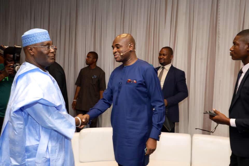 PDP presidential candidate, Atiku Abubakar and the presidential candidate of the Young Progressives Party (YPP), Kingsley Moghalu exchanging pleasantries at the venue of the presidential debate (Twitter/@atiku)