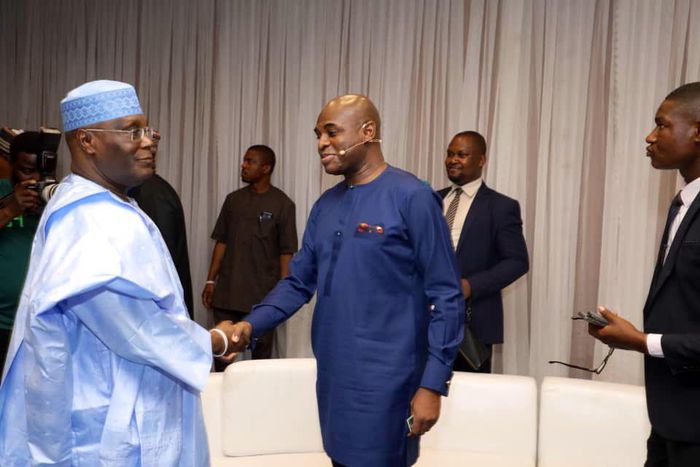 PDP presidential candidate, Atiku Abubakar and the presidential candidate of the Young Progressives Party (YPP), Kingsley Moghalu exchanging pleasantries at the venue of the presidential debate (Twitter/@atiku)