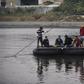Honduran migrants heading to the United States in a caravan cross the Suchiate River, the natural border between Guatemala and Mexico, in makeshift rafts without waiting for humanitarian visas offered by Mexico