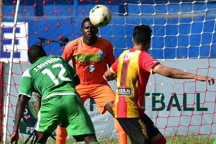 Gor Mahia goalkeeper Boniface Oluoch made a string of saves as the Kenyan club held New Star 0-0 in Cameroon to reach the CAF Confederation Cup group stage