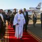Sudan's President Omar al-Bashir (C) is received upon his return from Qatar at Khartoum international airport