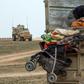 Hundreds of civilians have poured out of the last Islamic State group enclave in eastern Syria in recent days overwhelming the capacity of advancing Kurdish-led forces to process them