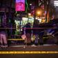Criminal investigators officers collect evidence at the scene of a blast in the center of Nairobi that wounded at least two people