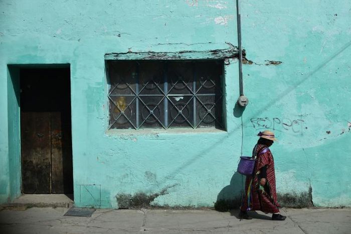 An indigenous woman walks in Tlaxiaco, in the southern Mexican state of Oaxaca, the modest hometown of Yalitza Aparicio, who has been nominated for a best actress Oscar for her performance in Alfonso Cuaron's "Roma"
