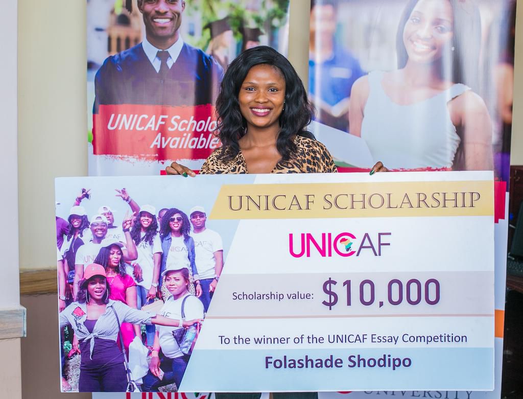Nigeria essay competition first prize winner with her giant cheque