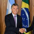 Argentina's President Mauricio Macri (L) and Brazilian President Jair Bolsonaro shake hands after signing an agreement at Planalto Palace in Brasilia, on January 16, 2019