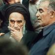 Ayatollah Ruhollah Khomeini surrounded by supporters in Tehran on February 1, 1979, on his return from exile