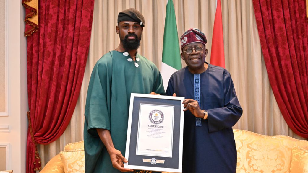L-R: Tunde Onakoya, a chess master, poses with his Guinness World Record plaque alongside President Bola Tinubu of the ruling party APC. [Tunde Onakoya/X, formerly Twitter]
