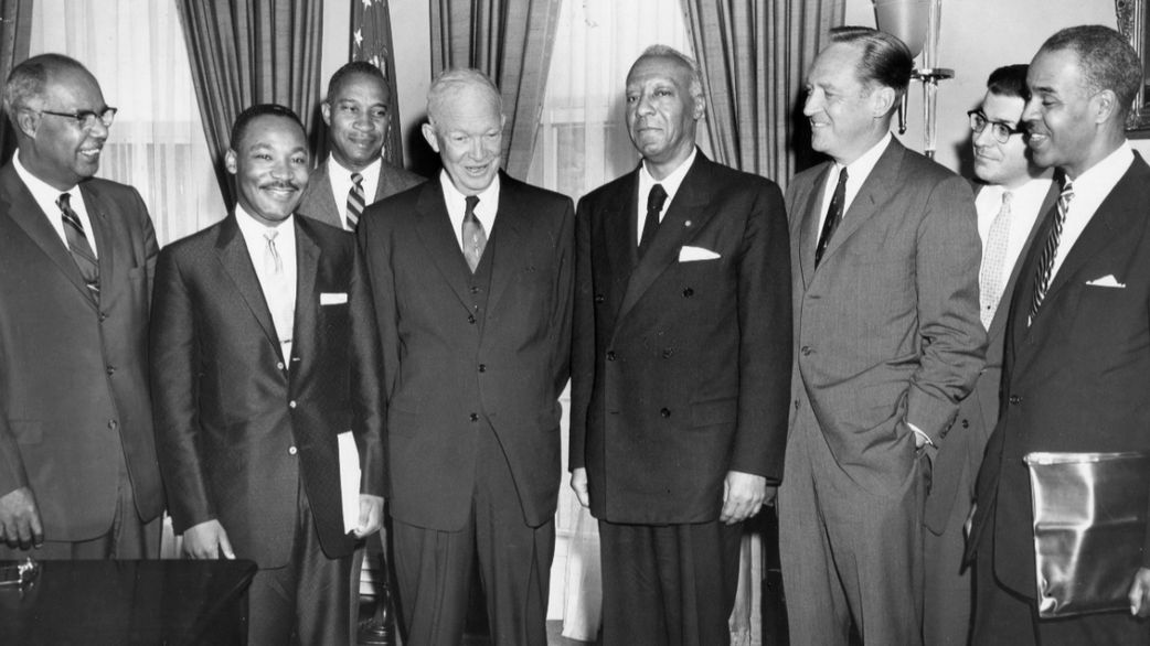 President Dwight D Eisenhower poses in his office with Martin Luther King Jr and other civil rights leaders following their conference on problems of school integration of African-Americans, Washington DC, June 23rd 1958. [PhotoQuest/Getty Images]