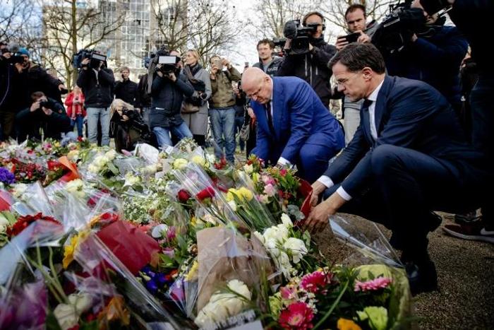 Polls show the centre-right coalition of Dutch premier Mark Rutte (R), seen here paying tribute to the Utrecht attack victims, is headed for major losses