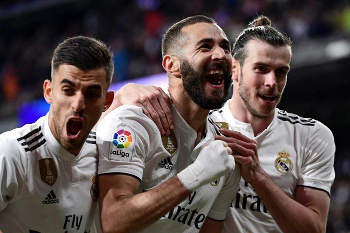 Karim Benzema fired Real Madrid to a late 3-2 win over La Liga's bottom club Huesca on Sunday