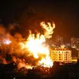 Fire and smoke billow above buildings in Gaza City during reported Israeli strikes on March 25, 2019