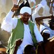 Sudanese opposition leader and ex-prime minister Sadiq al-Mahdi is greeted by supporters in Omdurman on January 26, 2017 as he returns from exile