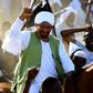 Sudanese opposition leader and ex-prime minister Sadiq al-Mahdi is greeted by supporters in Omdurman on January 26, 2017 as he returns from exile