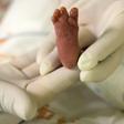 A pediatric nurse holds a premature baby after feeding him at Medellín's General hospital on August 20, 2014 in Medellin, Colombia. A Greek mother of the first baby born using DNA from three people has praised the revolutionary technique