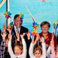 German Chancellor Angela Merkel joined Norway's Minister of Petroleum and Energy Kjell Borge Freiberg (left) and the chairman of energy group E.ON Johannes Teyssen (right) and a group of schoolchildren to open the new wind park