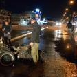 Iraqi security forces inspect the scene of the car bomb attack outside a restaurant in Iraq's Mosul