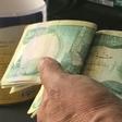 The United States is sanctioning seven financiers who allegedly helped funnel money to the Islamic State group -- seen here are 10,000-dinar banknotes in Iraq