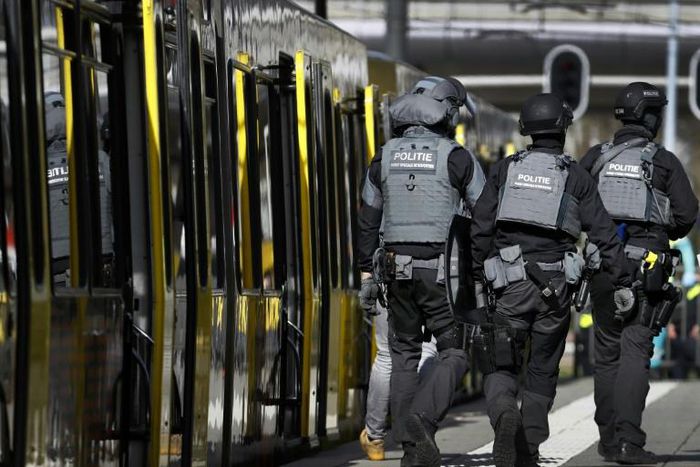 Armed police and emergency services swarmed the scene after the shooting in the city of Utrecht