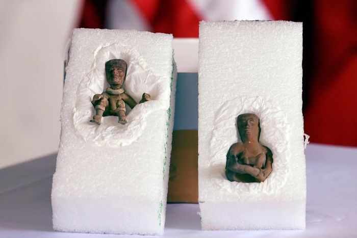 Anthropomorphic clay figures belonging to the Teotihuacan culture are displayed at the US Embassy in Mexico City during a ceremony where the US Federal Bureau of Investigation handed them back after a raid on the home of a US collector