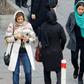 Iranian women wearing hijab walk down a street in the capital Tehran in this file picture taken on February 7, 2018